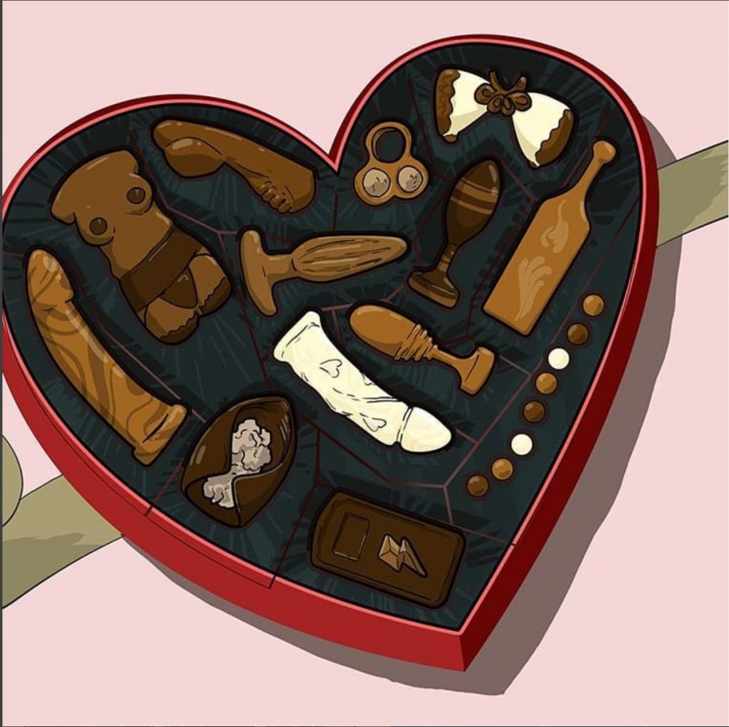 a love heart shaped box with sex toy shaped chocolates insite - including dildos, butt plugs, uderwear and a ruby glow!