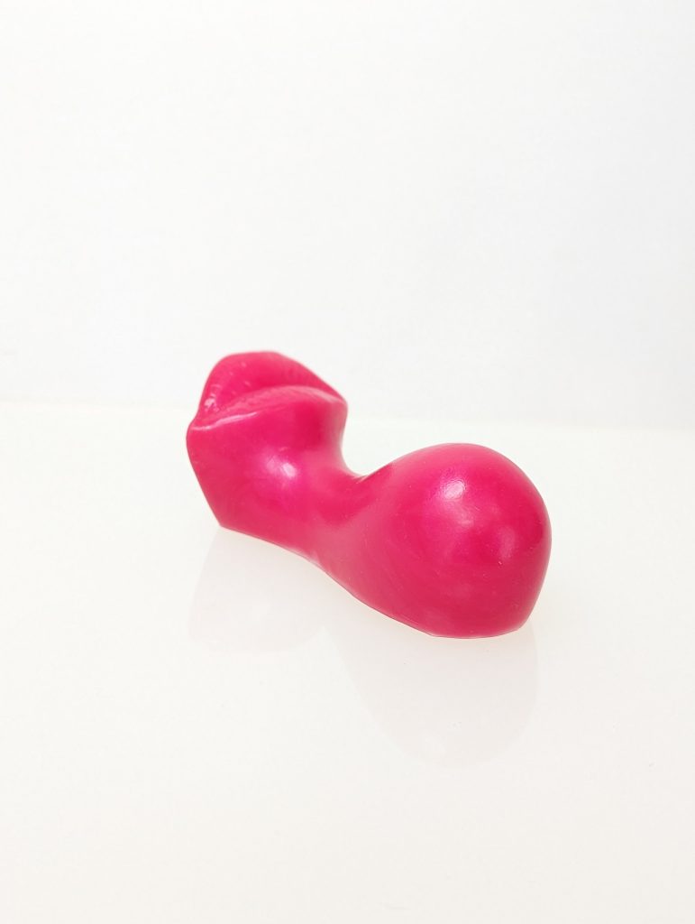 ruby glow rides Kiss -  a silicone grinder in red - the shape of lips